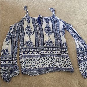Blue and white patterned cold shoulder top